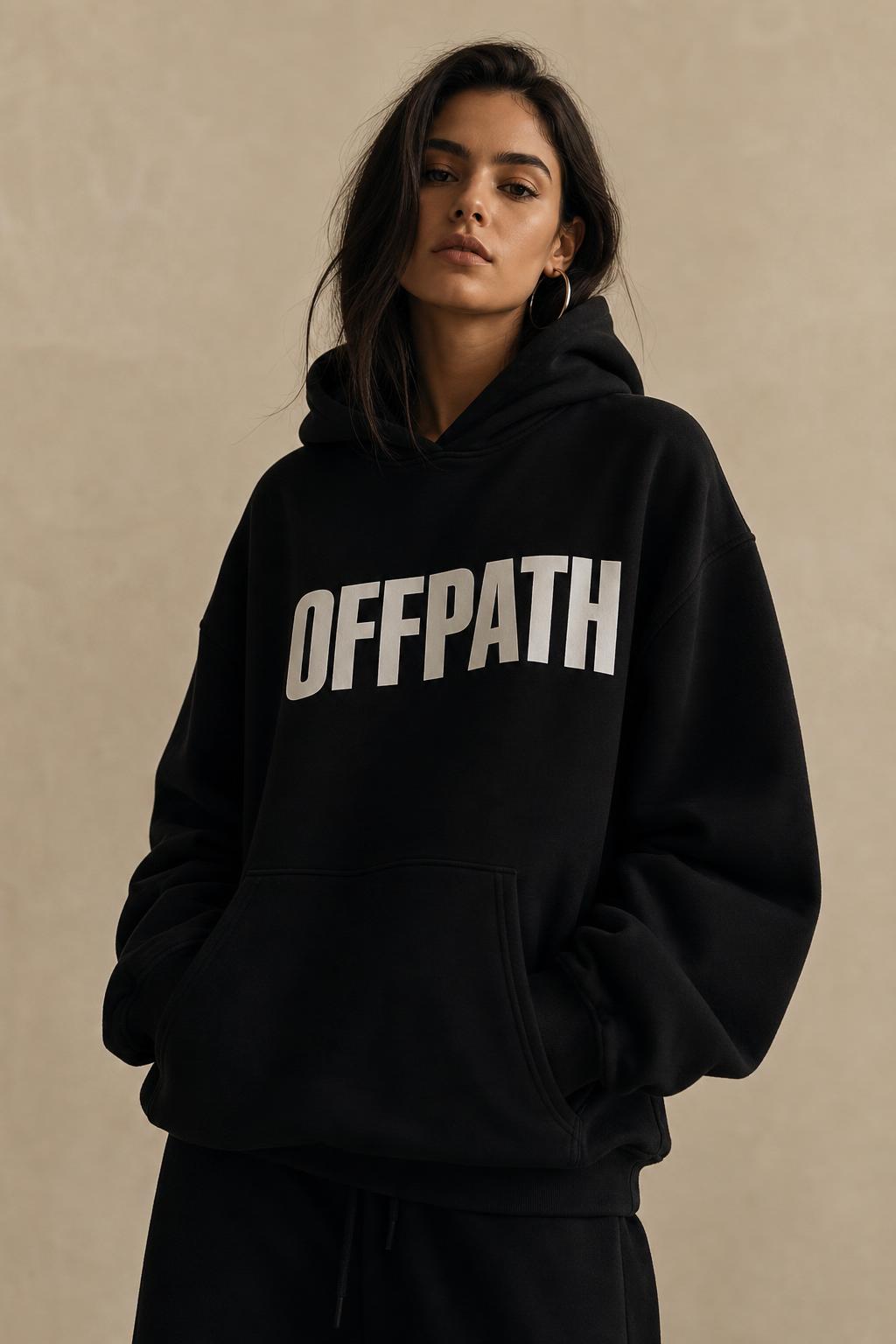 OFFPATH male model seated in tonal stone sweatsuit
